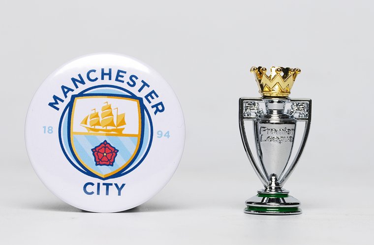 Man City Logo and Premier League Trophy