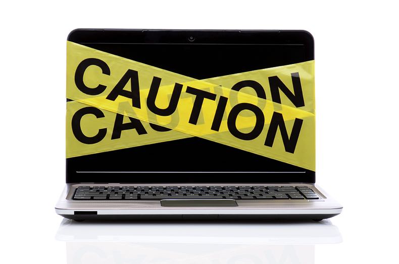 Caution tape on laptop